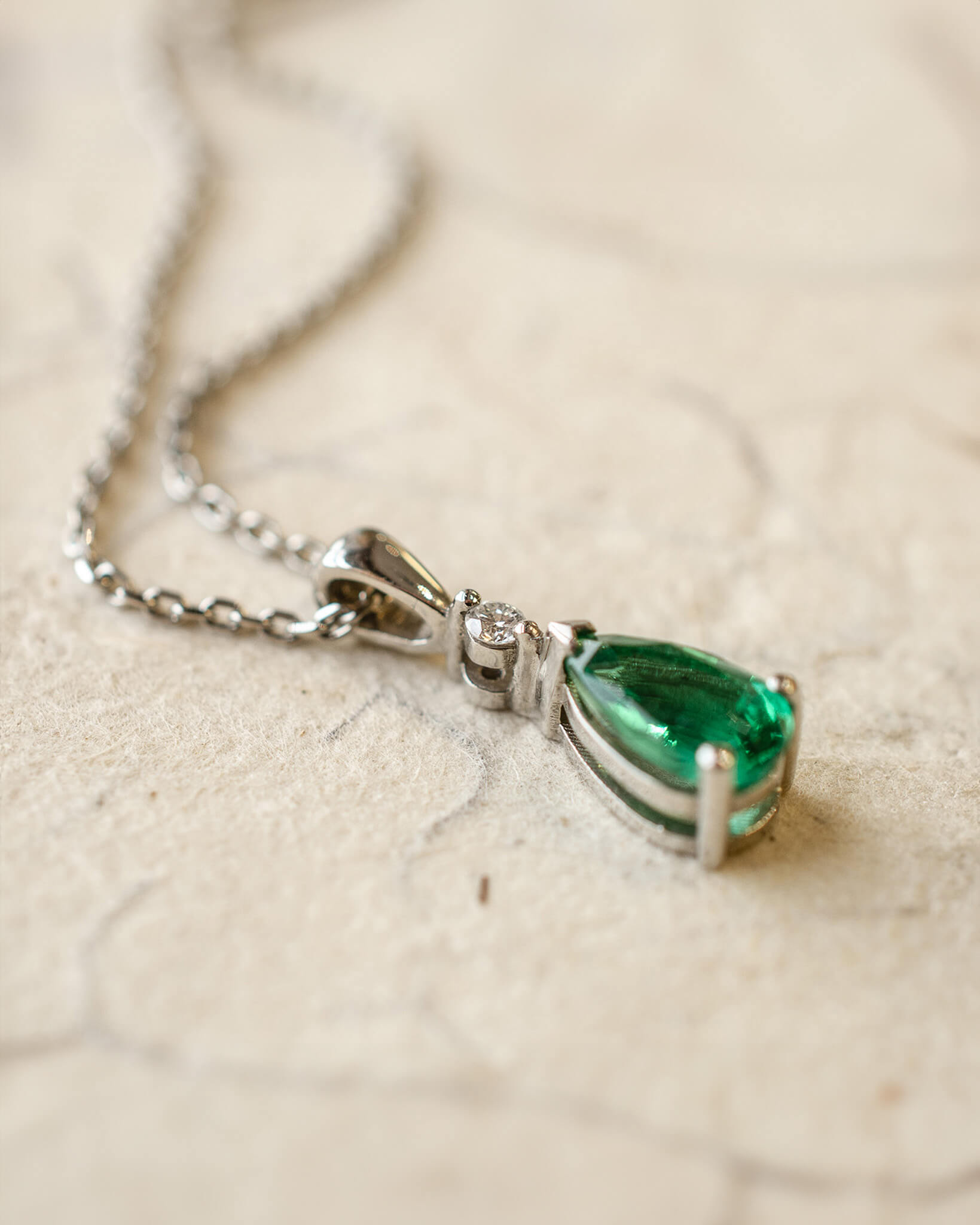 Platinum diamond and pear cut emerald necklace