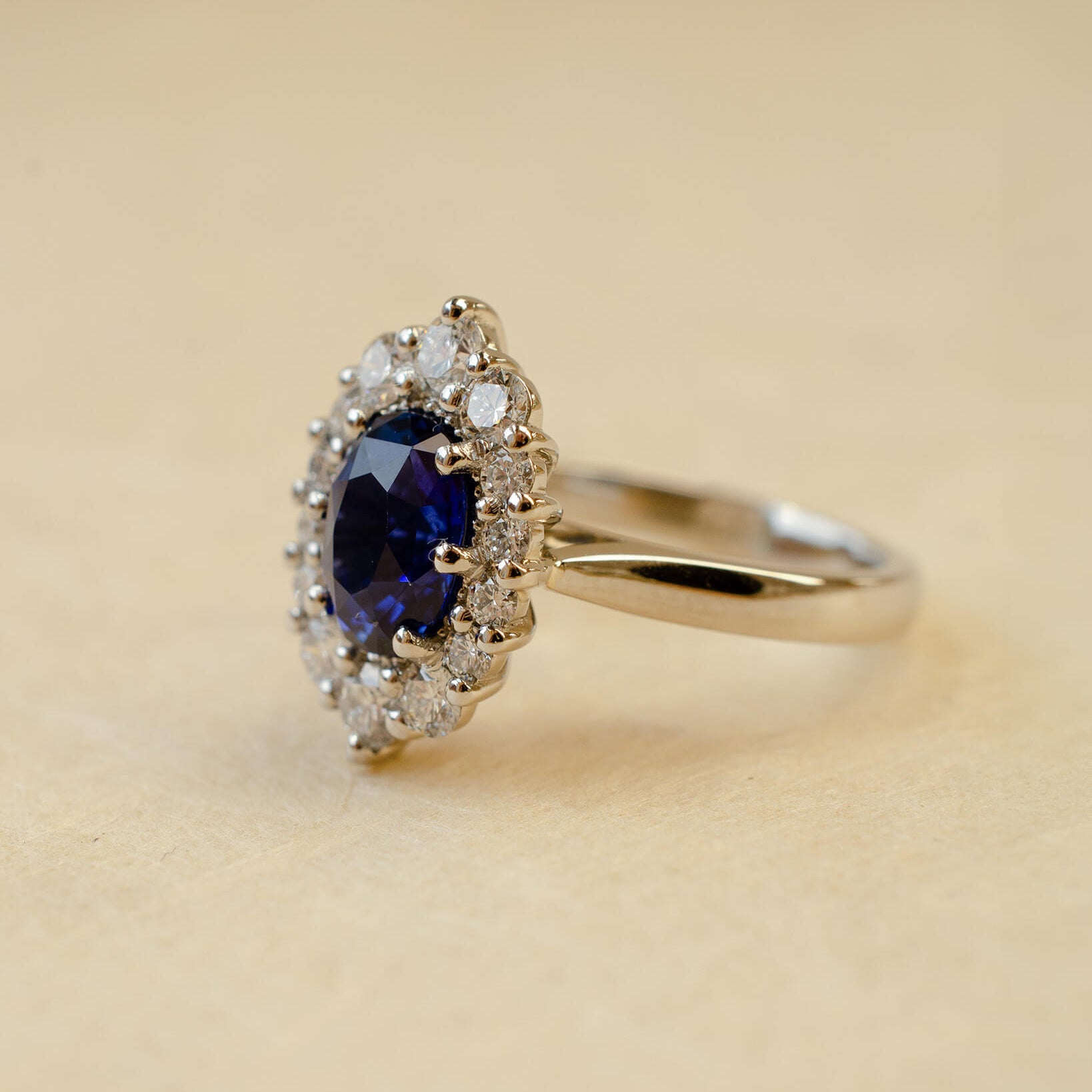 Platinum blue sapphire cluster style ring with white diamonds