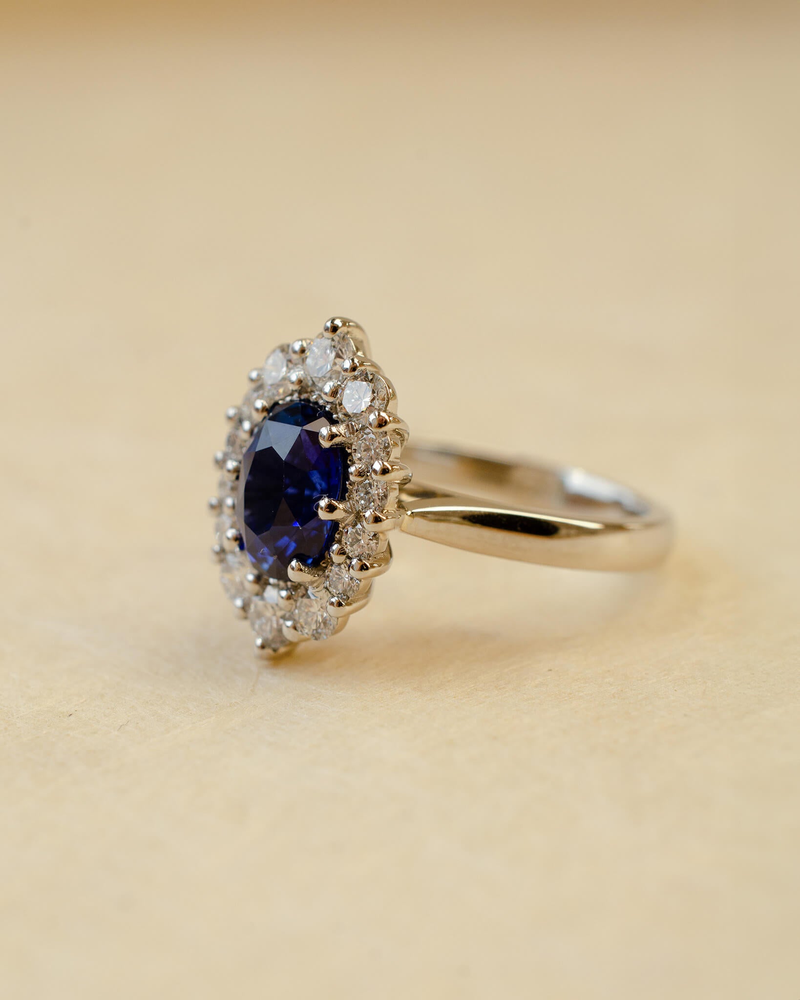 Platinum blue sapphire cluster style ring with white diamonds
