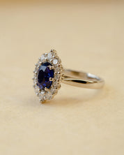 Platinum blue sapphire cluster style ring with white diamonds