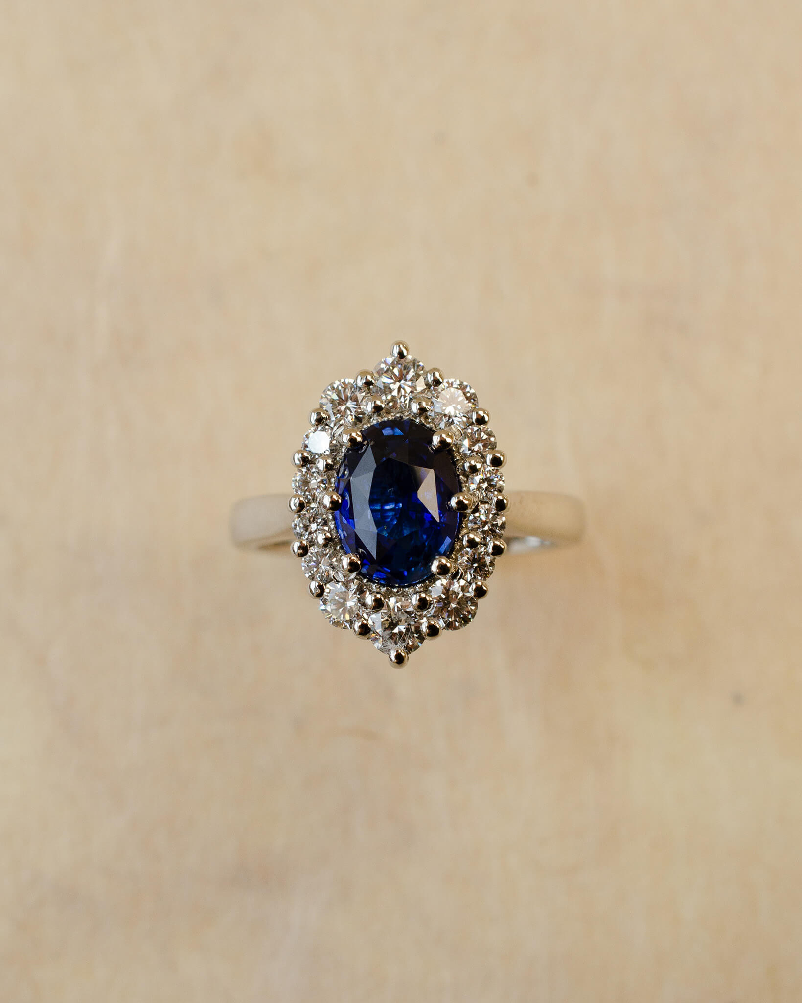 Platinum blue sapphire cluster style ring with white diamonds