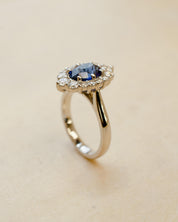 Platinum blue sapphire cluster style ring with white diamonds