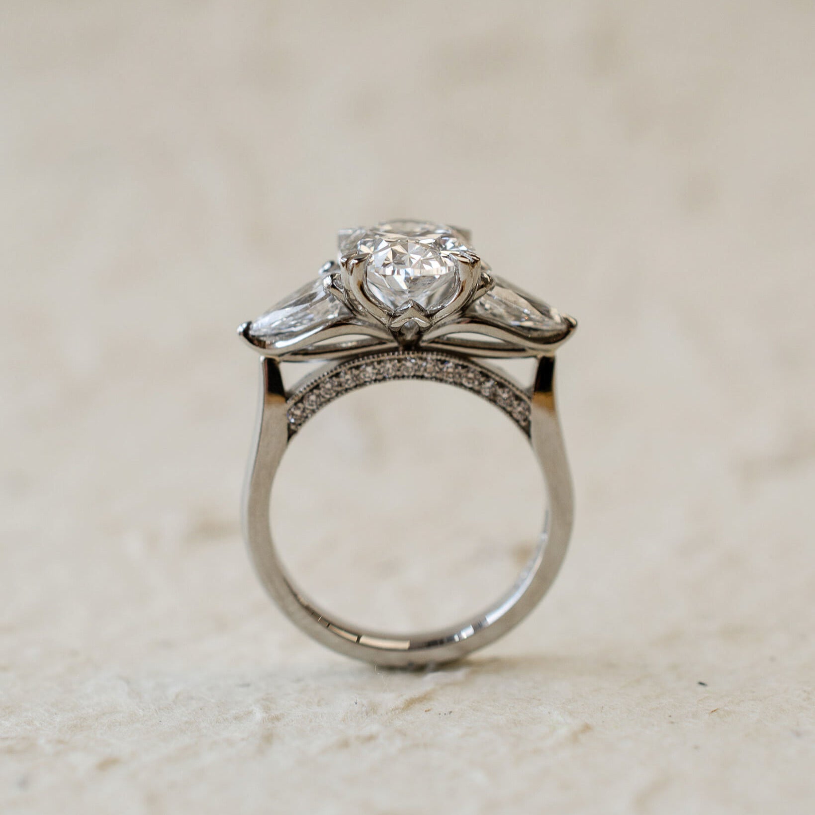 platinum trilogy ring with oval and pear lab-grown diamonds