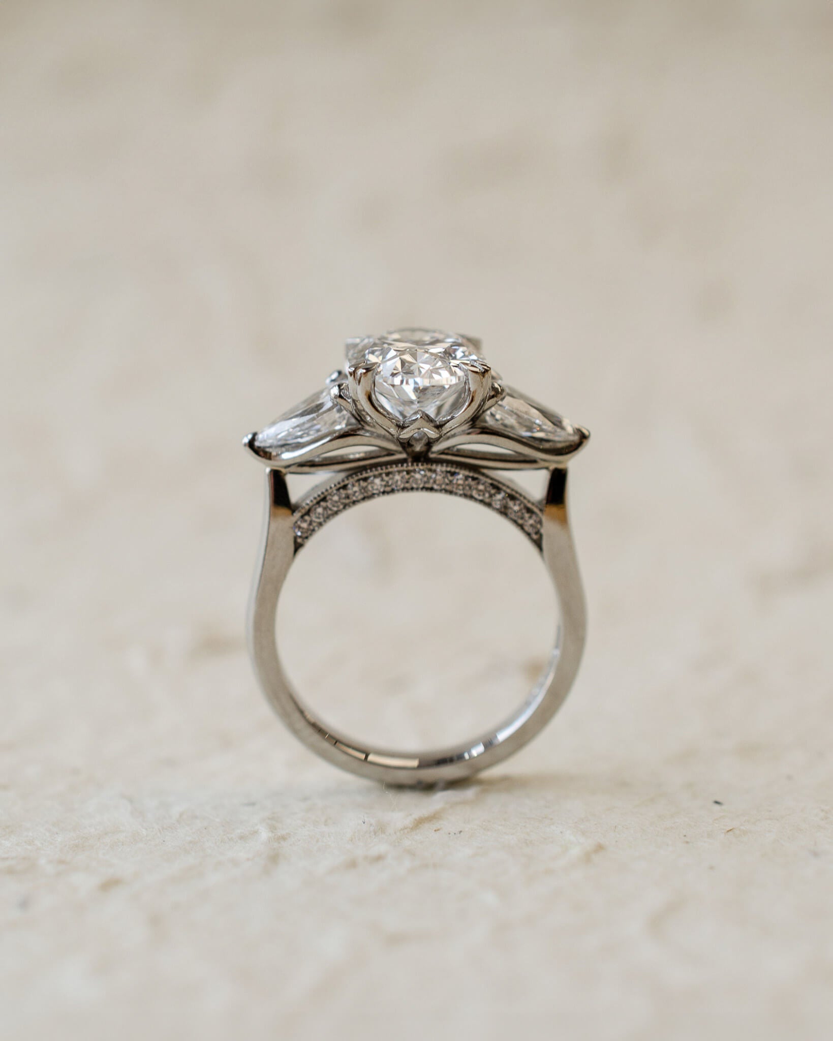 platinum trilogy ring with oval and pear lab-grown diamonds