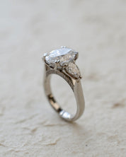 platinum trilogy ring with oval and pear lab-grown diamonds