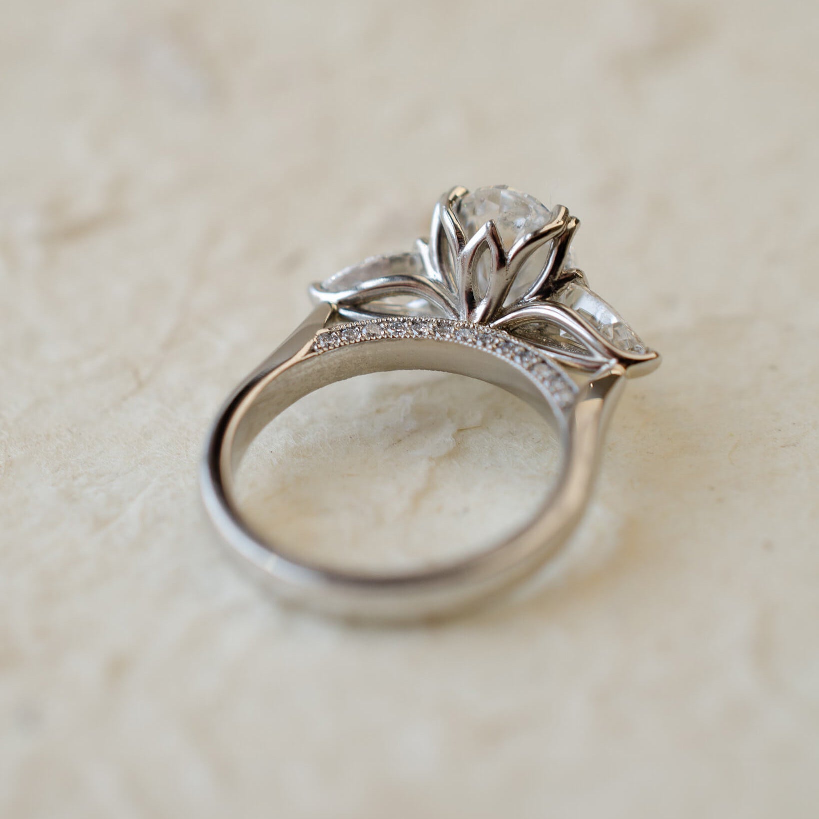 platinum trilogy ring with oval and pear lab-grown diamonds