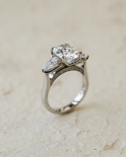 platinum trilogy ring with oval and pear lab-grown diamonds