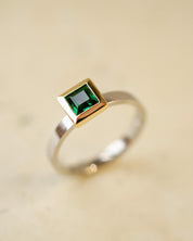platinum and 18ct yellow gold ring with princess cut emerald