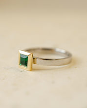 platinum and 18ct yellow gold ring with princess cut emerald