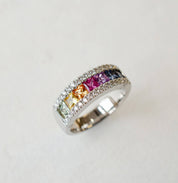 Platinum rainbow sapphire eternity ring with diamonds