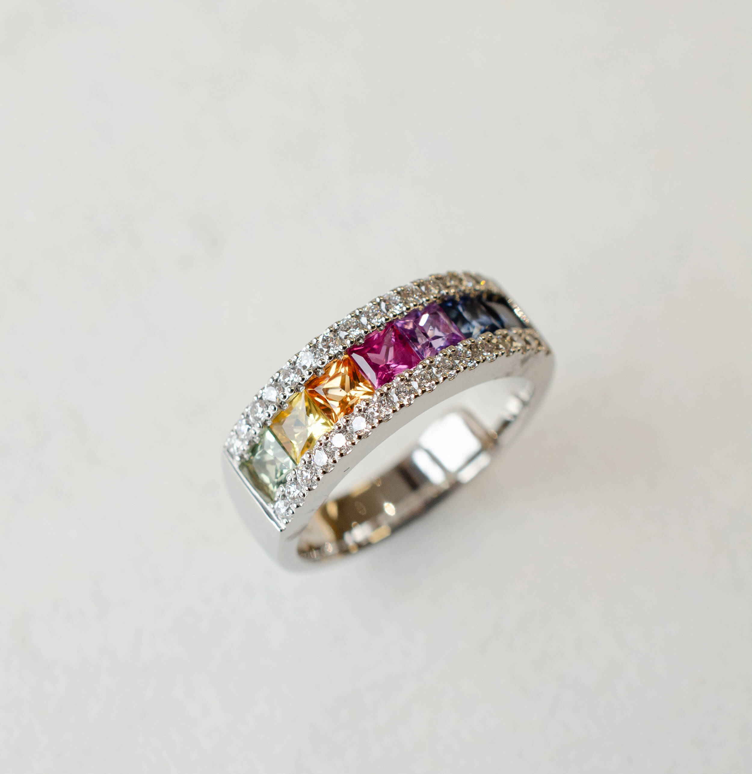 Platinum rainbow sapphire eternity ring with diamonds