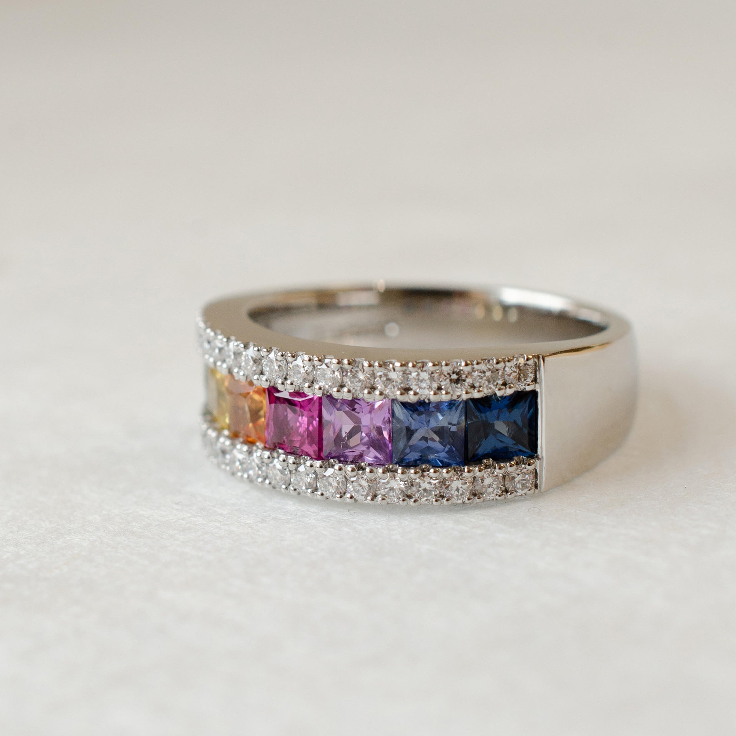 princess cut rainbow sapphire eternity ring in platinum