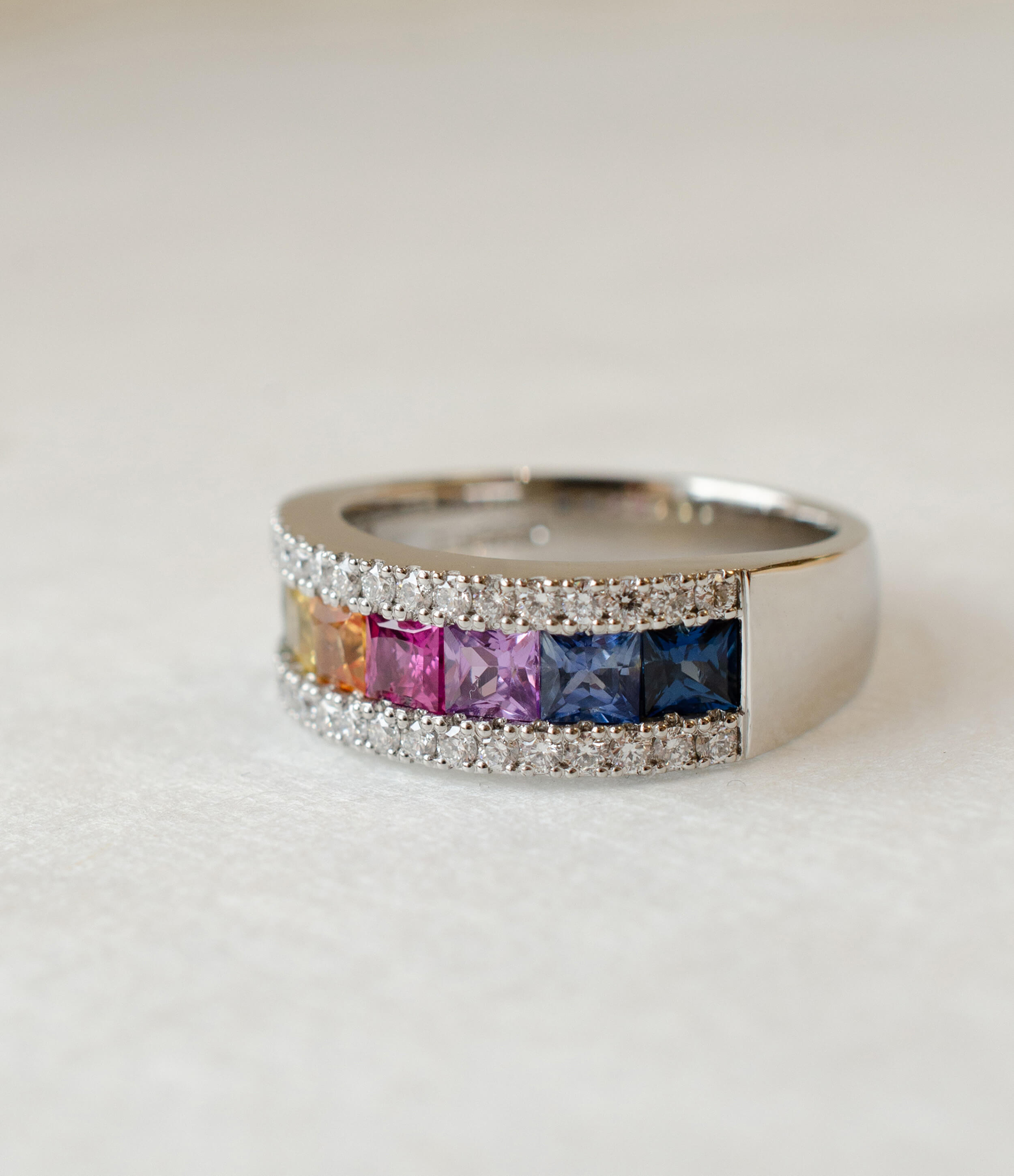 princess cut rainbow sapphire eternity ring in platinum