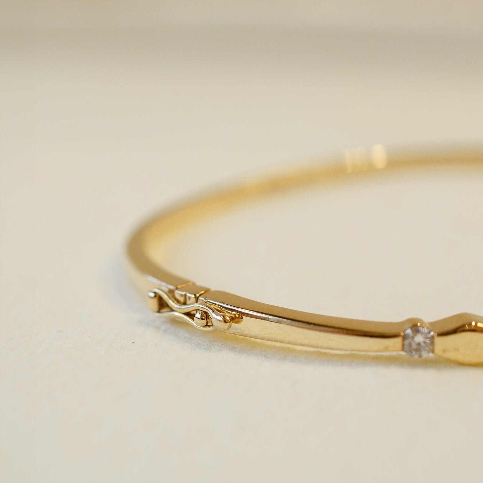 yellow gold hinged bangle with diamonds 