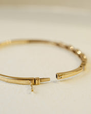 yellow gold hinged bangle with diamonds 