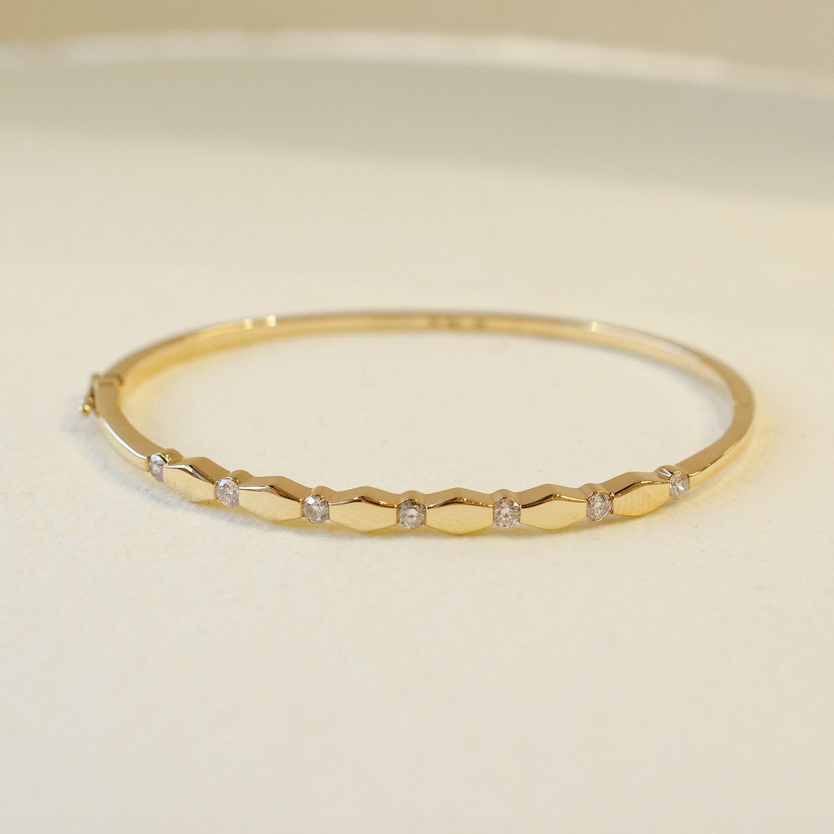 yellow gold hinged bangle with diamonds 