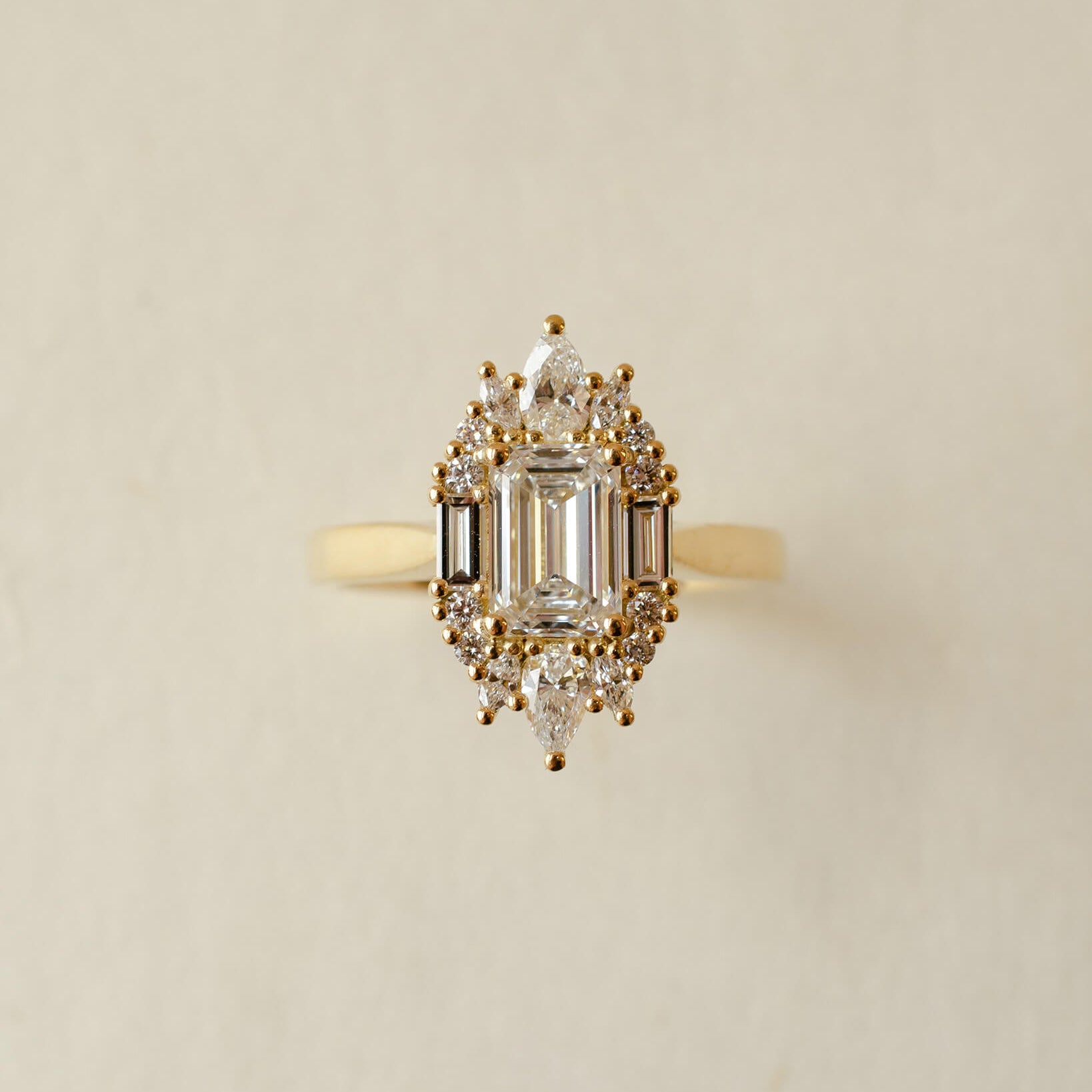 yellow gold and diamond emerald cluster engagement ring