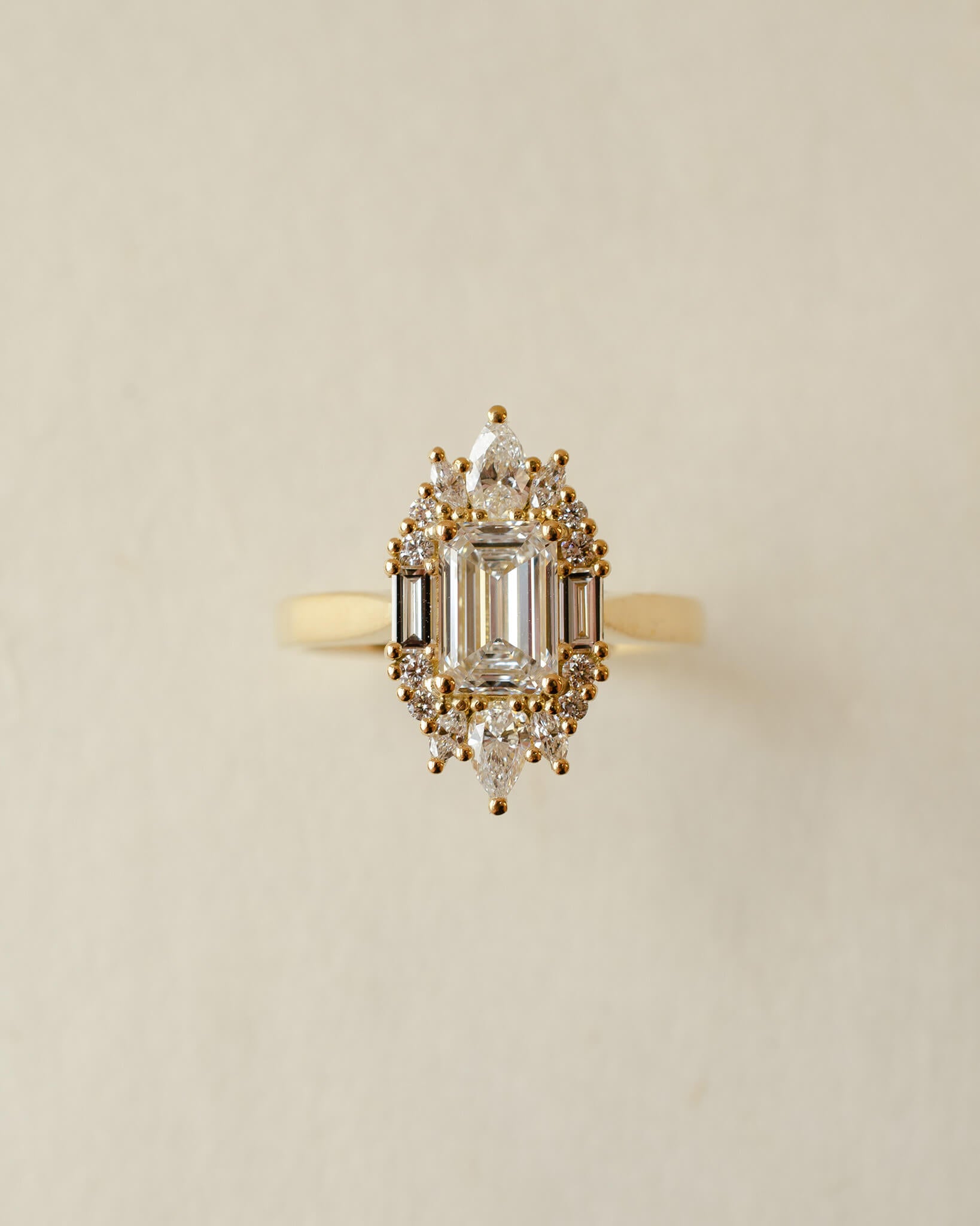 yellow gold and diamond emerald cluster engagement ring