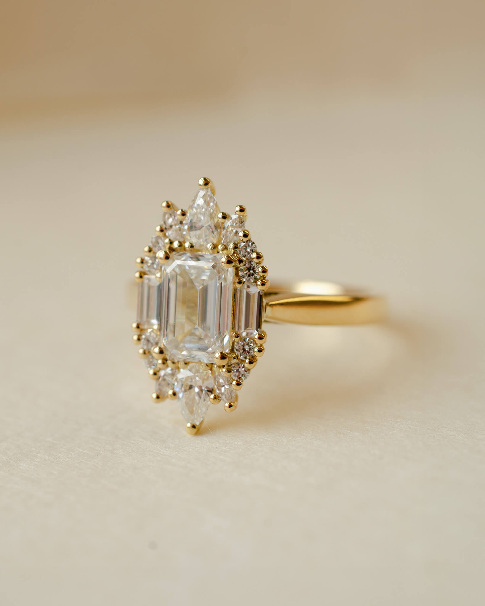 yellow gold and diamond emerald cluster engagement ring