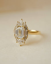 yellow gold and diamond emerald cluster engagement ring