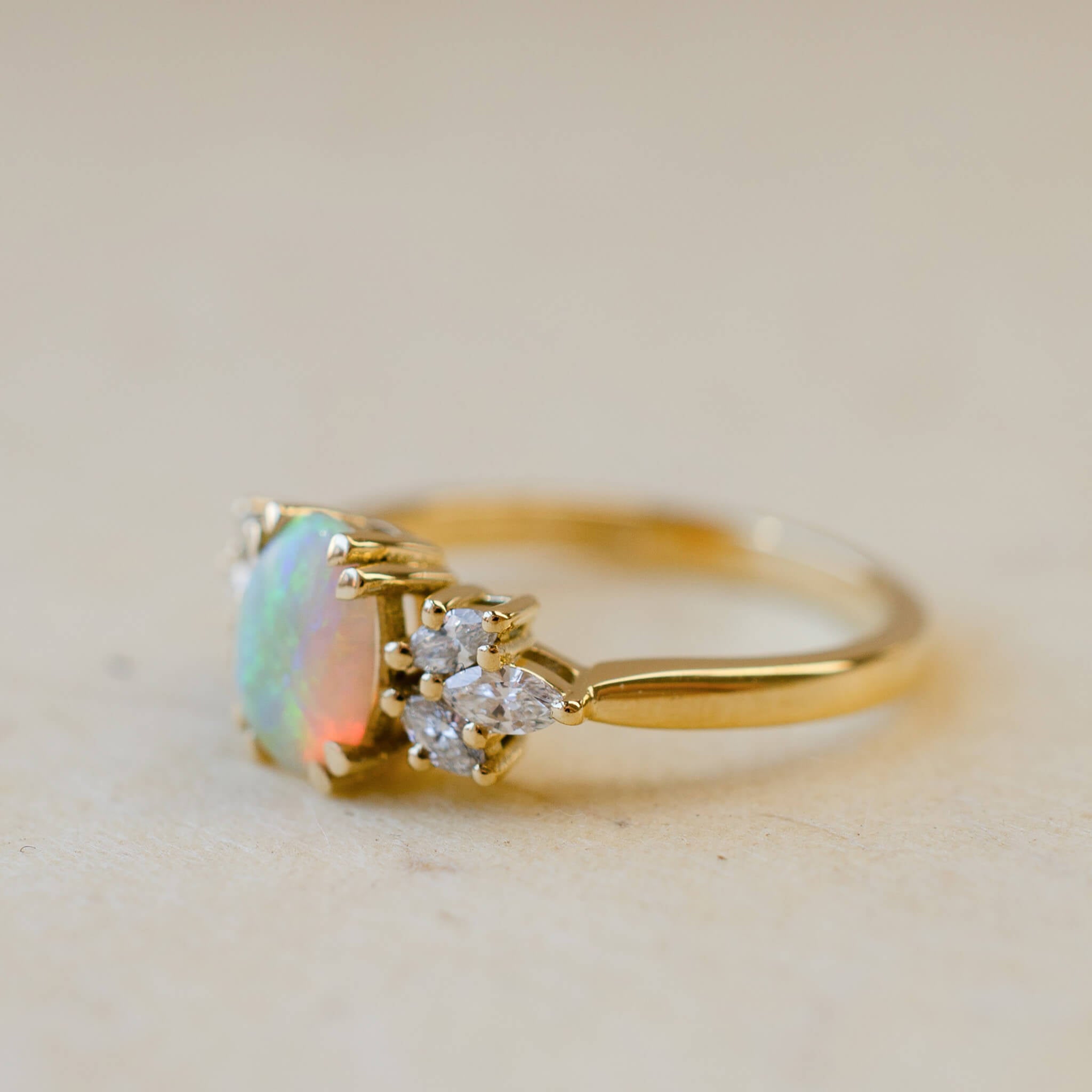 18ct yellow gold opal ring with diamond leaves
