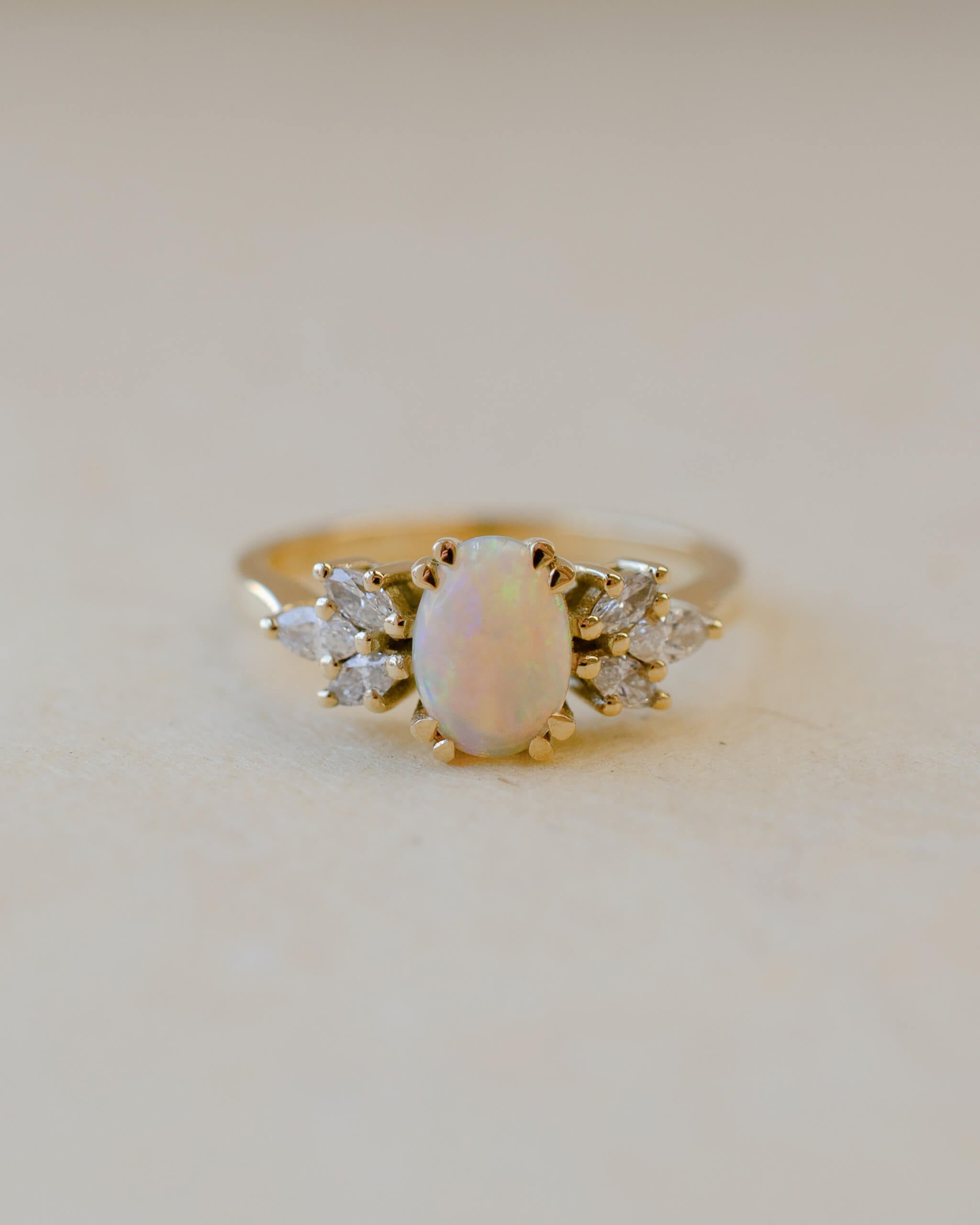 opal ring in 18ct yellow gold with diamond marquise cut leaves on shoulders