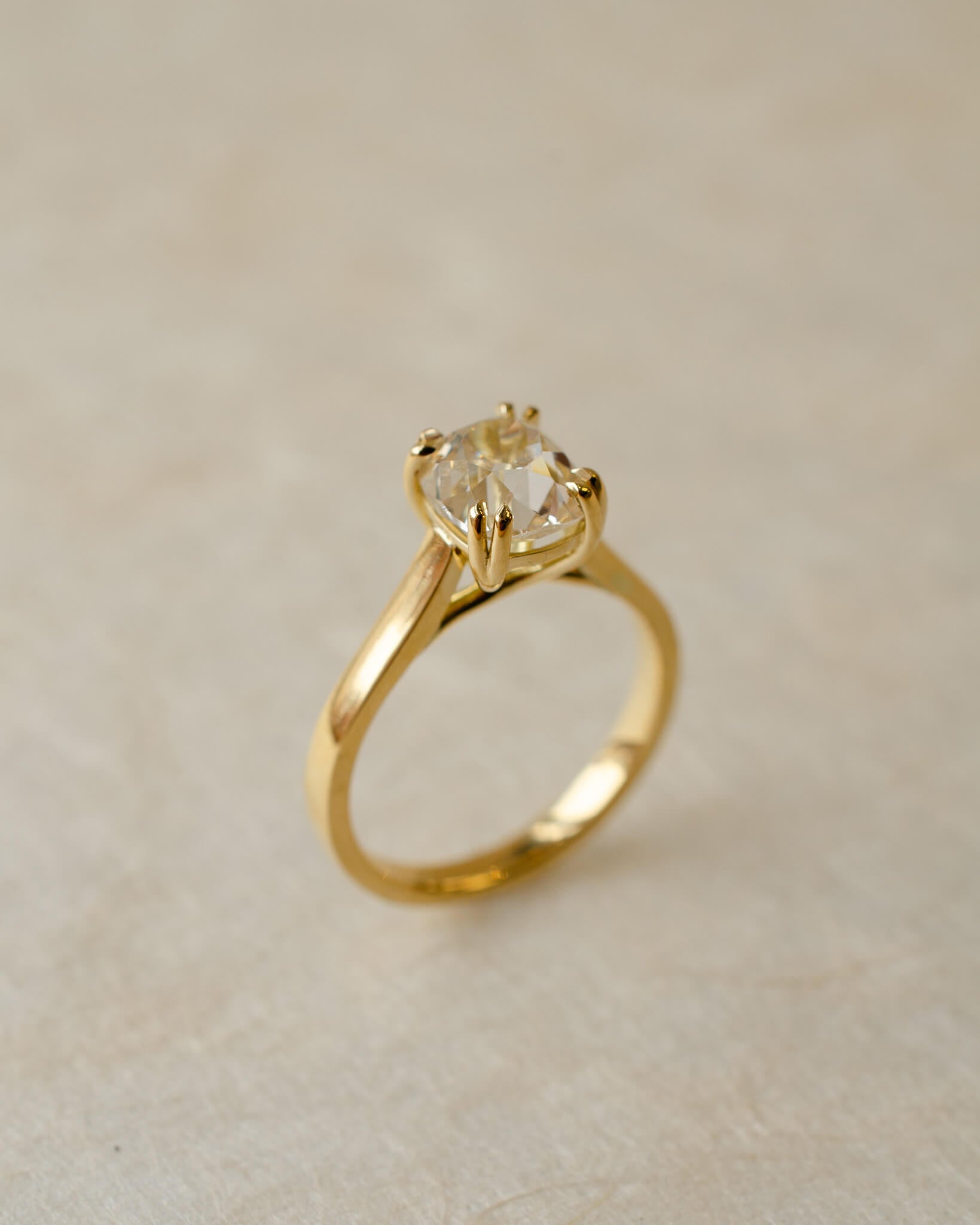 old cut diamond in solitaire style yellow gold engagement ring